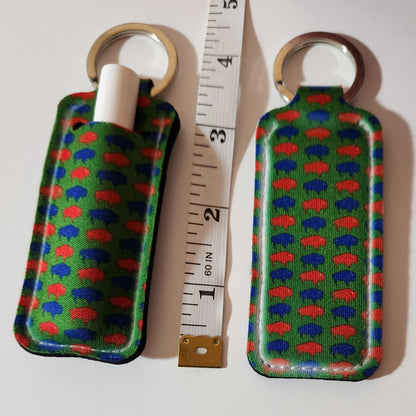 Green lip balm holder with blue and red Buffalos