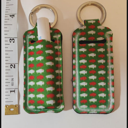 Green lip balm holder with white and red Buffalos