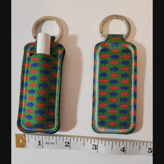 Green lip balm holder with blue and red Buffalos